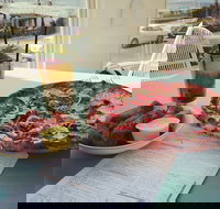 The Kitchen and Patio - Palm Beach Accommodation