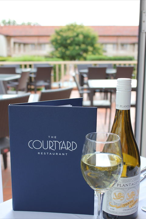 The Courtyard Restaurant - Palm Beach Accommodation 0