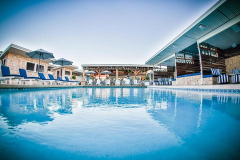 Rambutan Resort - Palm Beach Accommodation 0